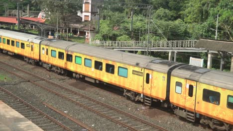 AC-coaches-of-passenger-train-standing-at-the-station,-Revealing-shot