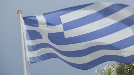 slow-motion close up shot of the greek flag flapping in the wind