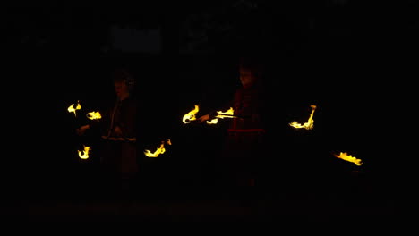 fire jugglers at night