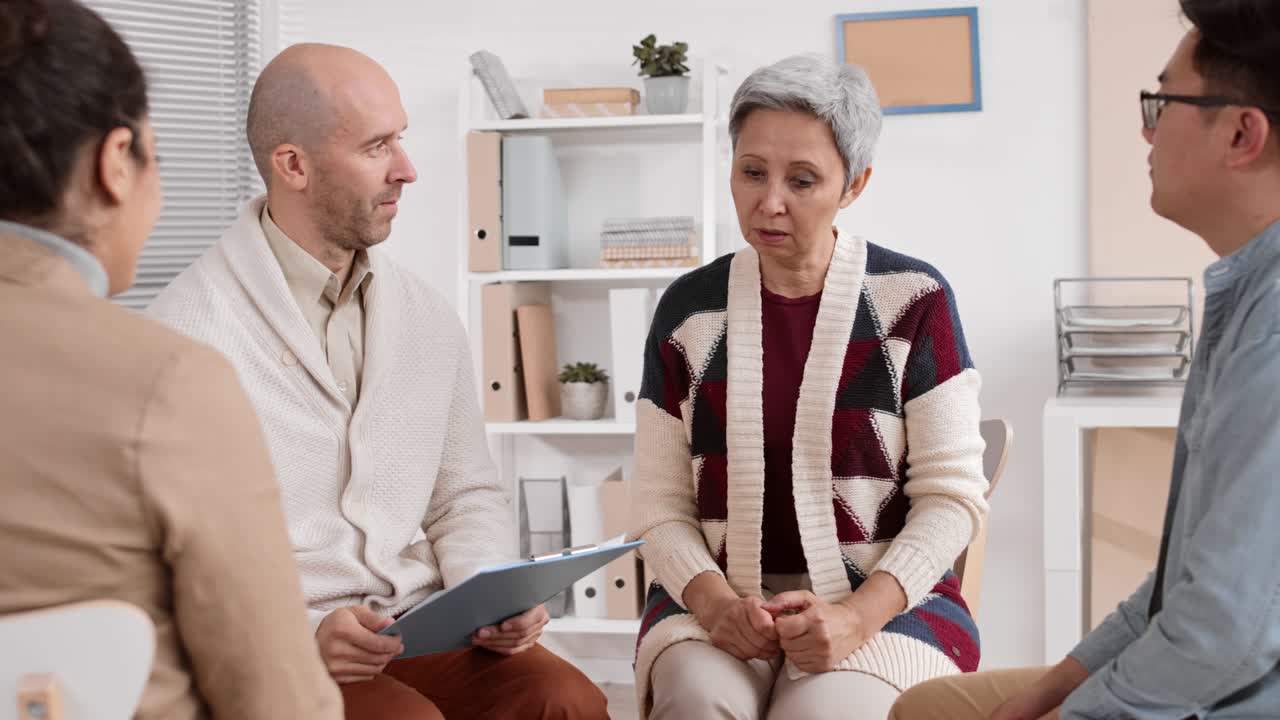 Senior Woman Talking on Group Therapy Meeting