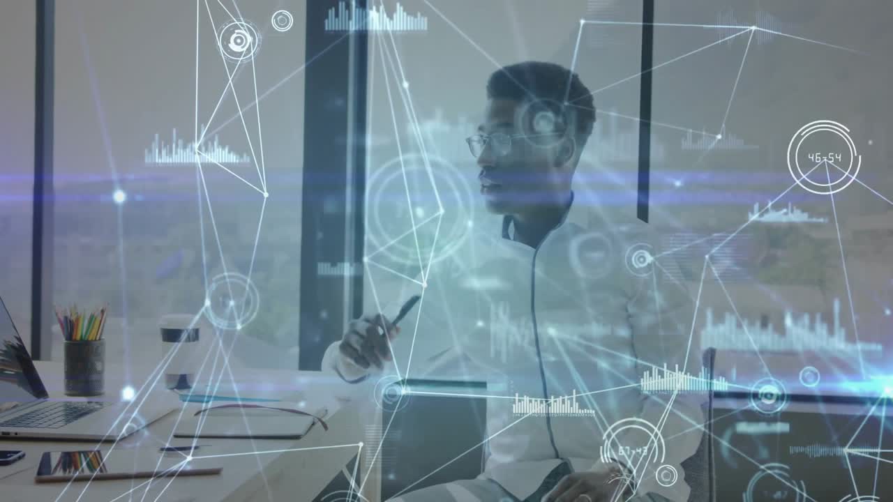 Male data analyst focusing on laptop and initiating hologram interface examining data nodes
