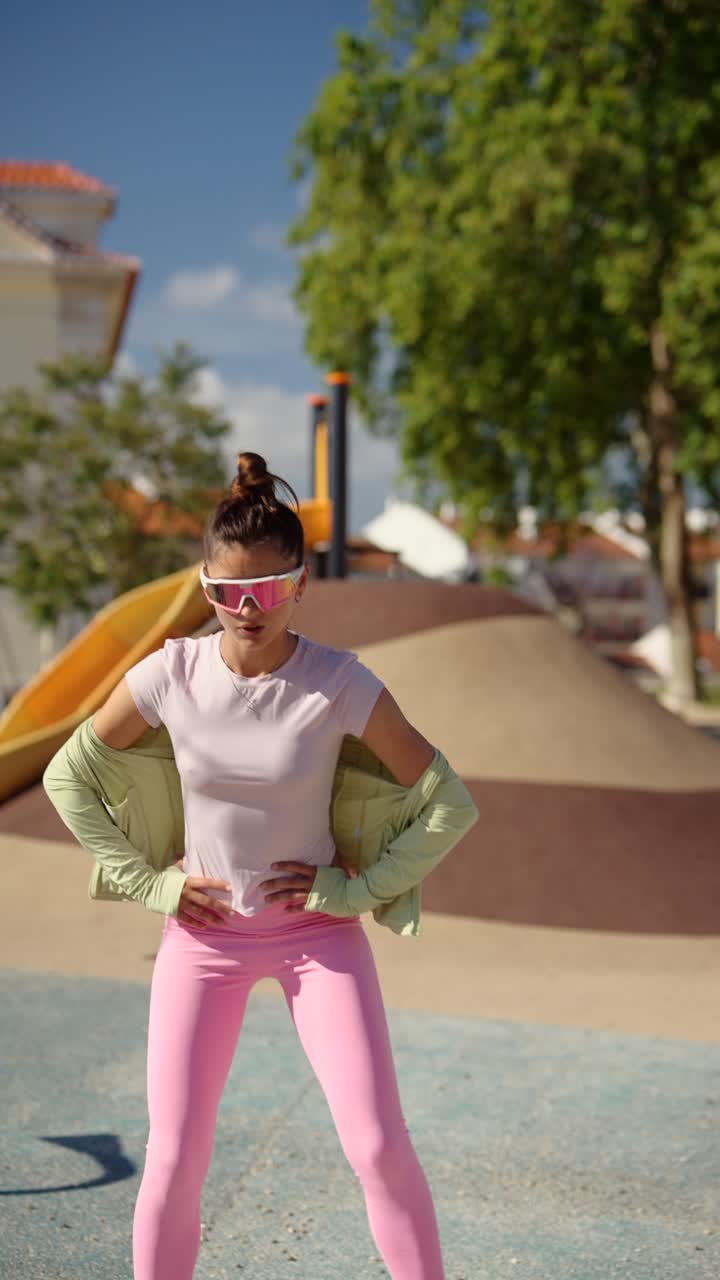 Woman in Sportswear Posing in a Park