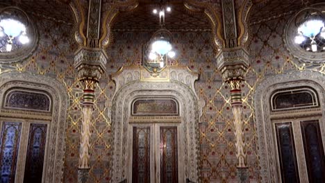 Tilt-down-shot-reveals-whole-decorated-Arabic-Room-of-Palacio-da-Bolsa-in-Porto