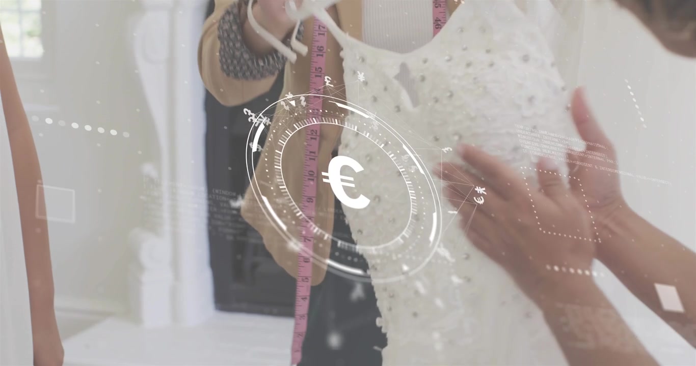 Seamstress selecting beaded dress with euro HUD as client adjusting hemline for fashion fitting