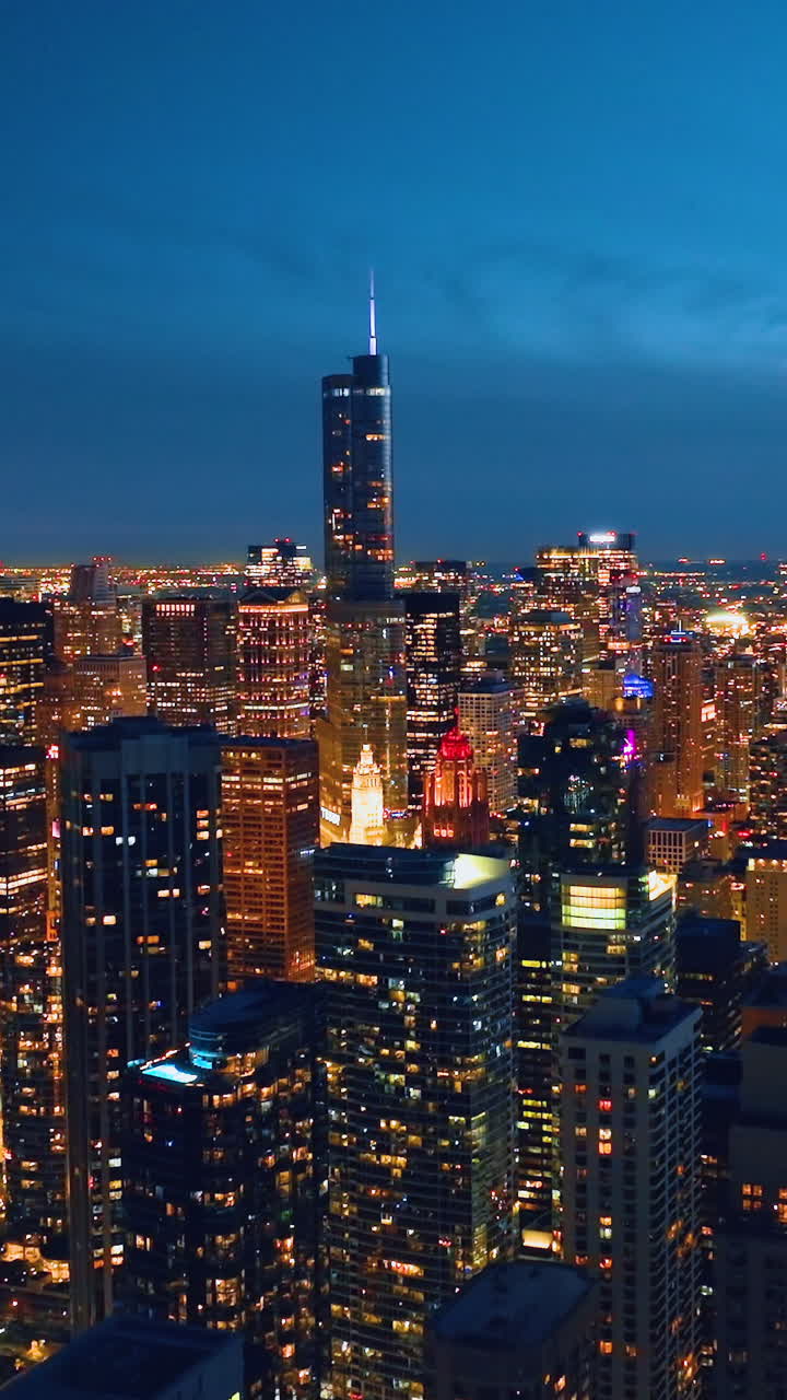 Skyscrapers cityscape downtown, Chicago skyline buildings. Real estate at night time. Empty rooftop aerial view. Vertical video