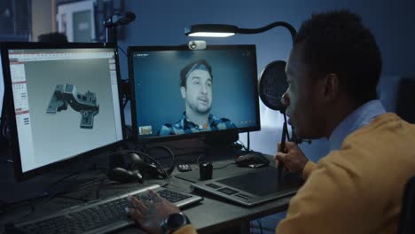 designer working on 3d model and video conferencing