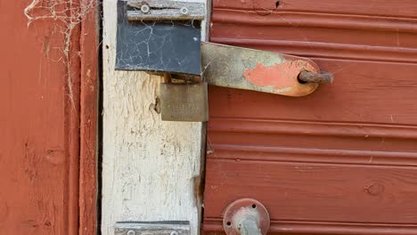 Close-up-Spider-Web-on-Padlock-and-Metal-Bar