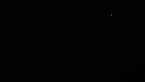 golden glitter magic shimmer light sparkles particles trail on black loop animation background 4k
