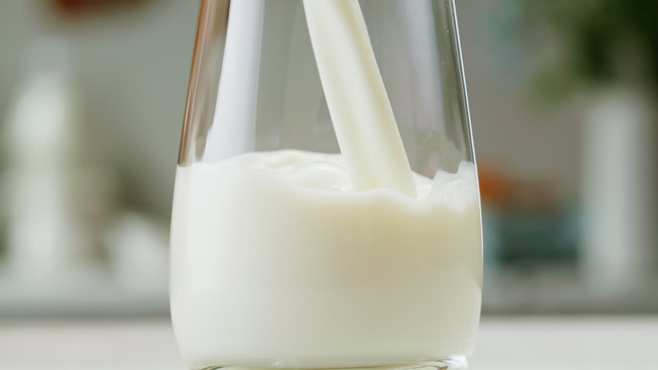 Milk being poured into a glass