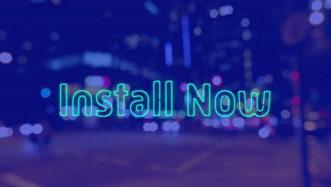 animation of install now text over cityscape at night on blue background