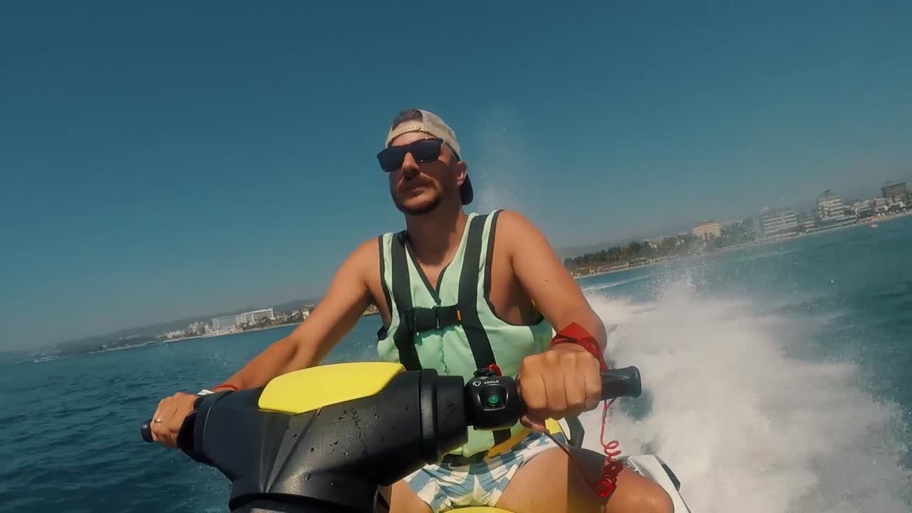 Man Riding Jet Ski on the Ocean