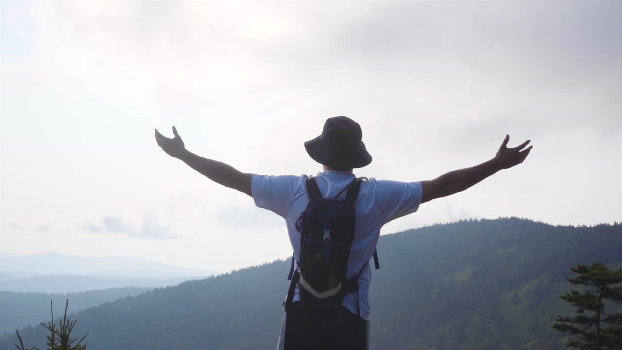 An epic shot of Nathan standing on a cliff in Tennessee.