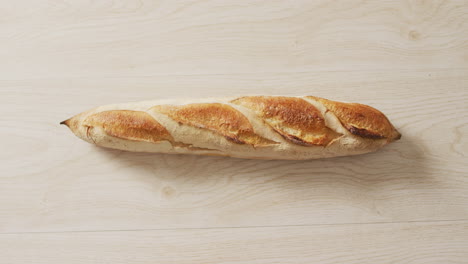 Video-of-close-up-of-baguette-on-a-black-surface