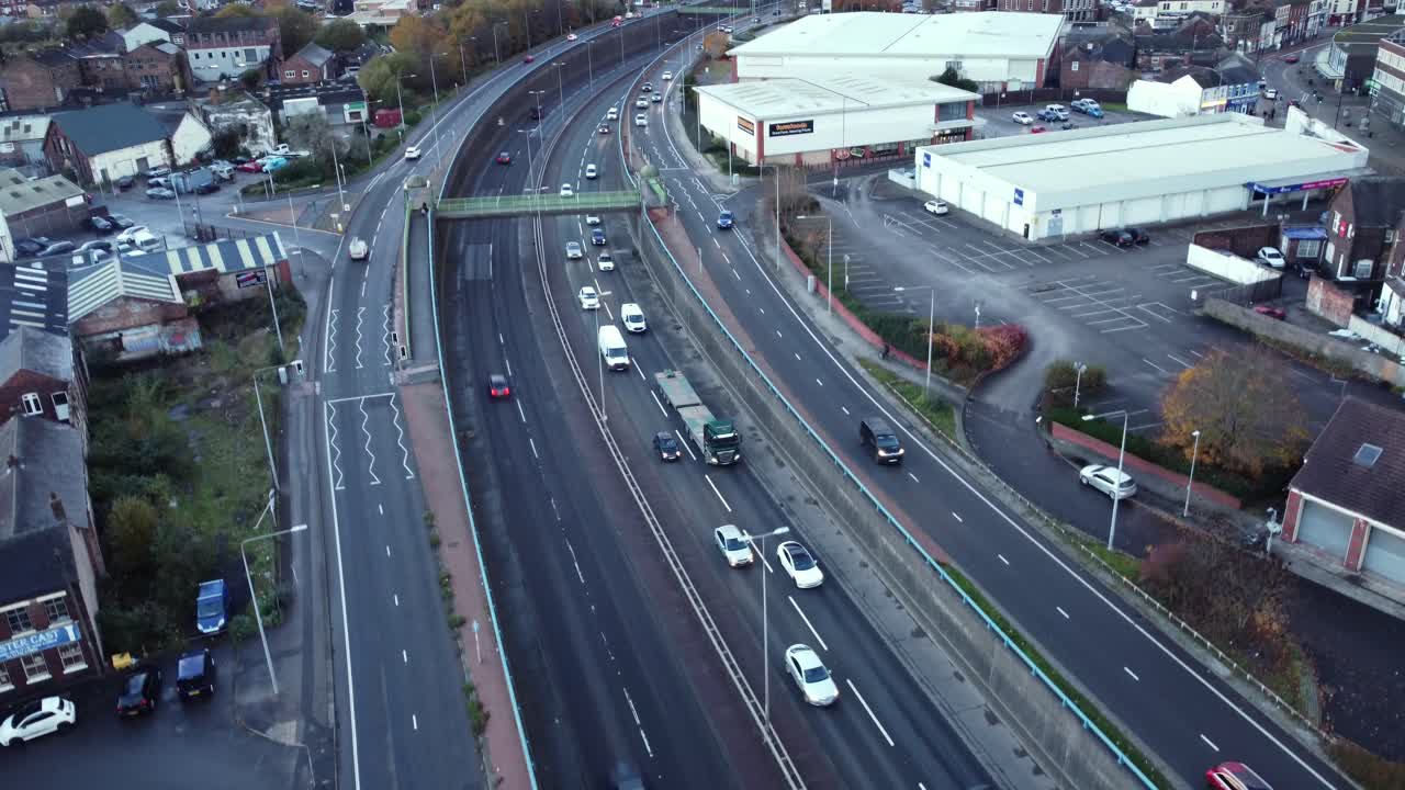 Aerial View of a City Highway with Traffic and Buildings