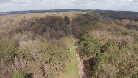 Wide aerial shot flying over the Natchez Trace Parkway in Mississippi
