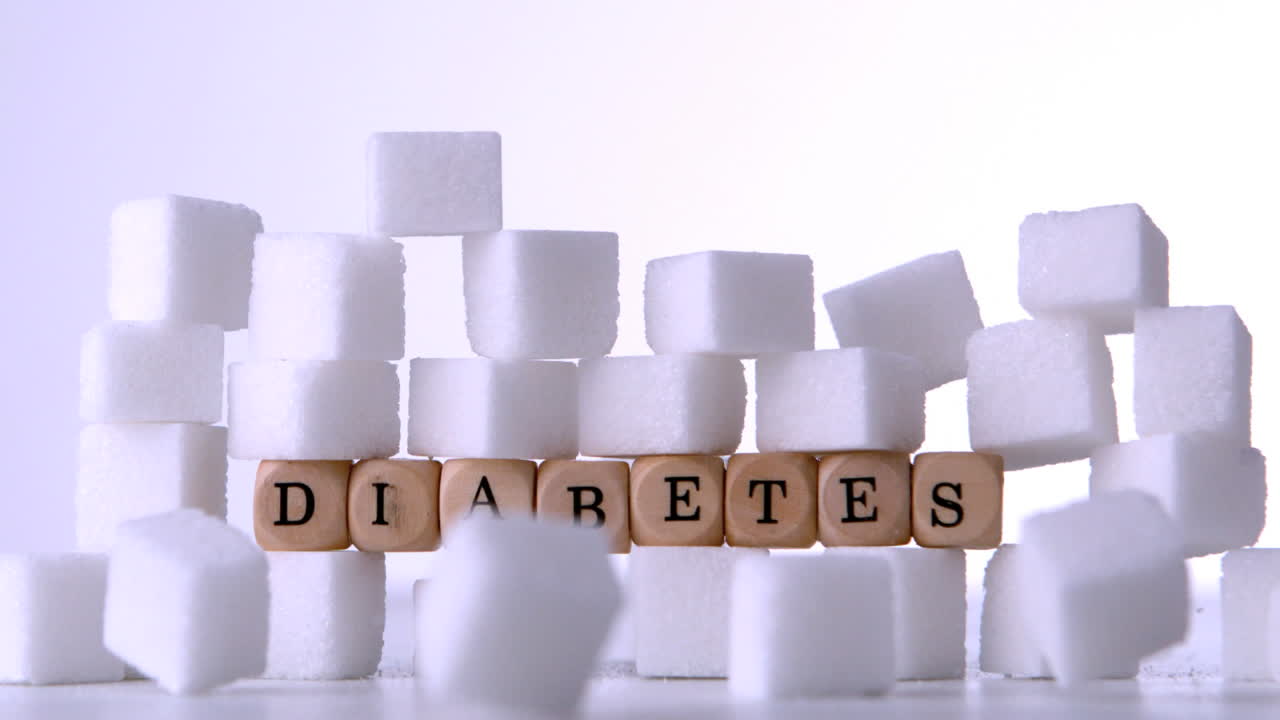 당뇨병을 표기하는 주사위 앞에 떨어지는 설탕 큐브