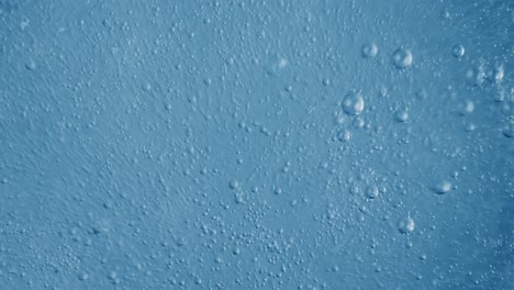 oxygen bubbles in water on a blue abstract background