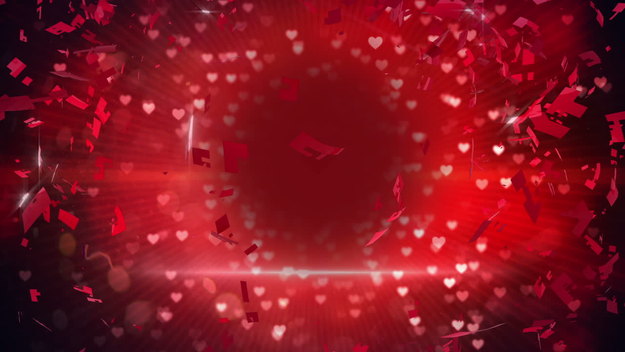 corazón rojo girando y explotando en un fondo brillante