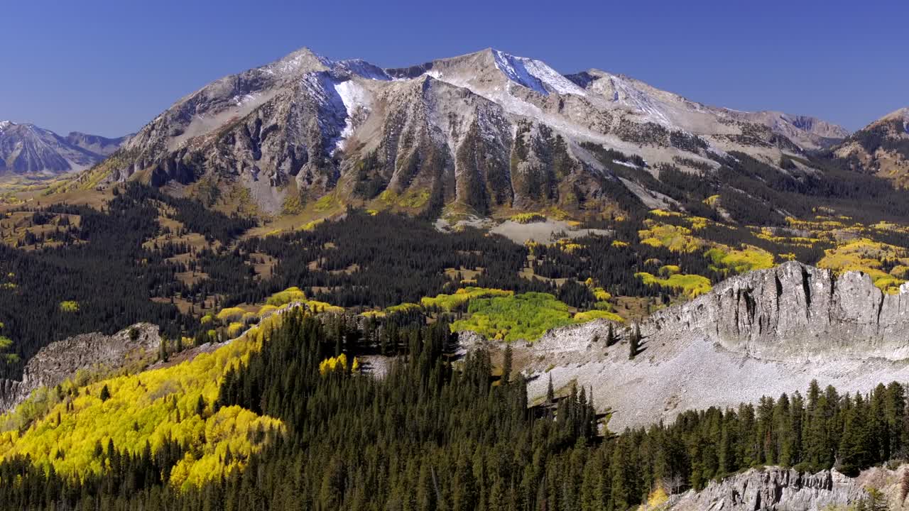 Aerial views of Colorado's East Beckwith mountain range during the vibrant colorful fall season