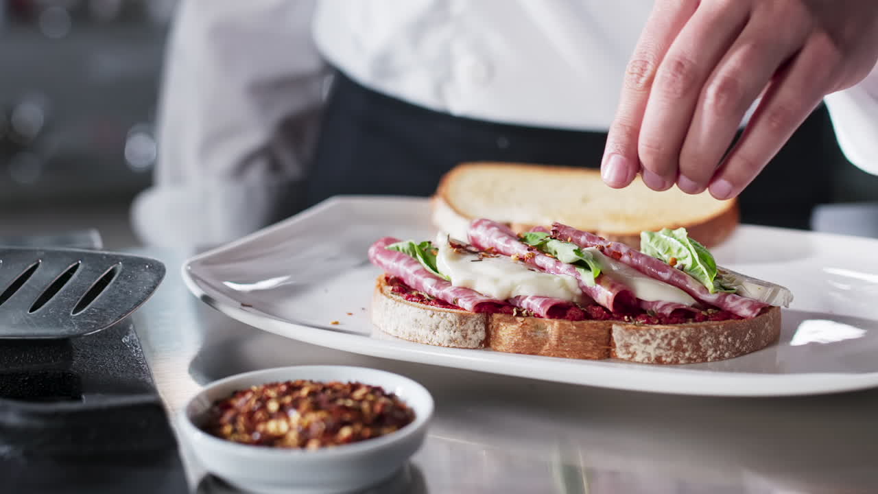 Chef Preparing a Delicious Salami and Mozzarella Sandwich