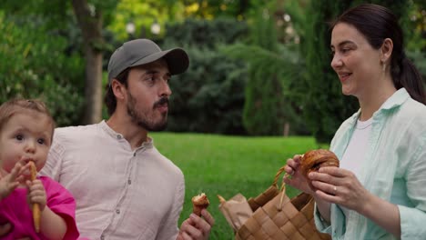 happy family enjoying a picnic in the park