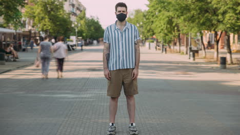man wearing a face mask in the city
