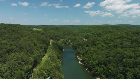 Hogscald-Hollow-in-Arkansas-immersed-in-peaceful-green-forest,-aerial,-summer