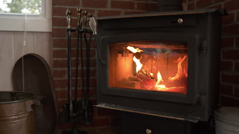 wood stove with a fire blazing inside