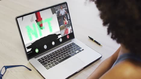 African-american-businesswoman-using-laptop-for-video-call-with-diverse-business-colleagues