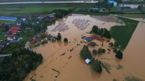 Horrific-Aerial-4K-Drone-footage-of-houses-in-Podravje,-Slovenia,-during-August-floods