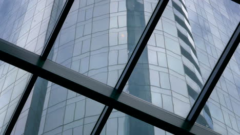 a modern skyscraper seen through glass panels