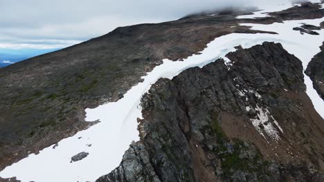 Wild-and-rugged-mountain-peaks-surrounding-Crater-Lake-in-Britsih-Columbia,-Canada