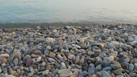 pebbles on the beach at sunset