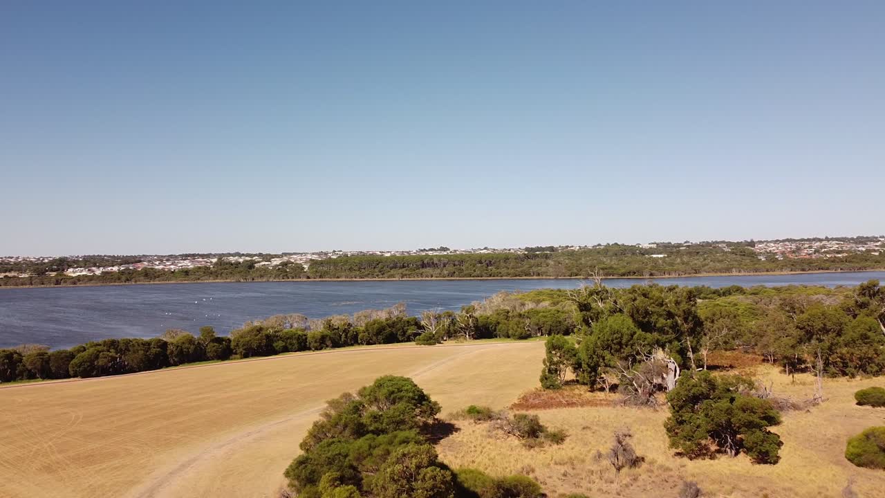 Aerial view of the blue waters of Lake Joondalup and surrounding area