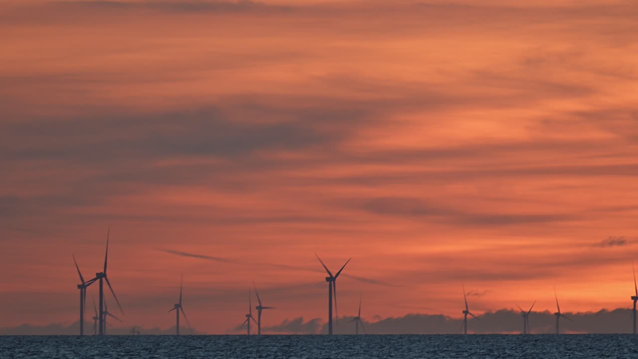 Offshore wind farm and sunset colors in the North Sea off the coast of the Netherlands