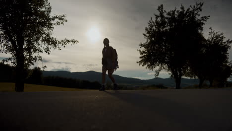 Female-tourist-exploring-nature-while-walking-on-road