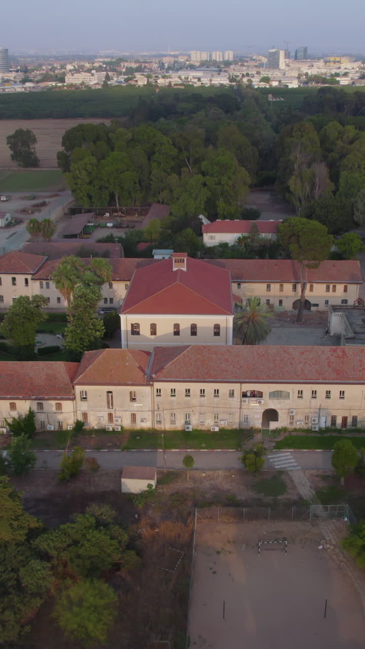 The old Charles Netter Synagogue in Mikveh Israel at sunset - Vertical video Parallax shot