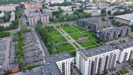 aerial view of residential complex with green courtyard