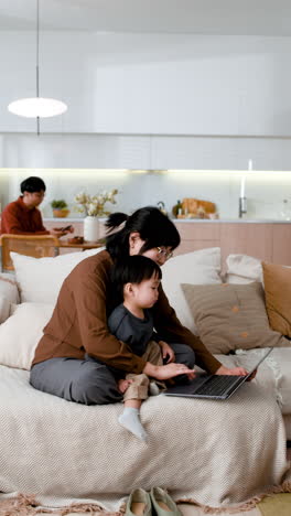 mother and child working together at home