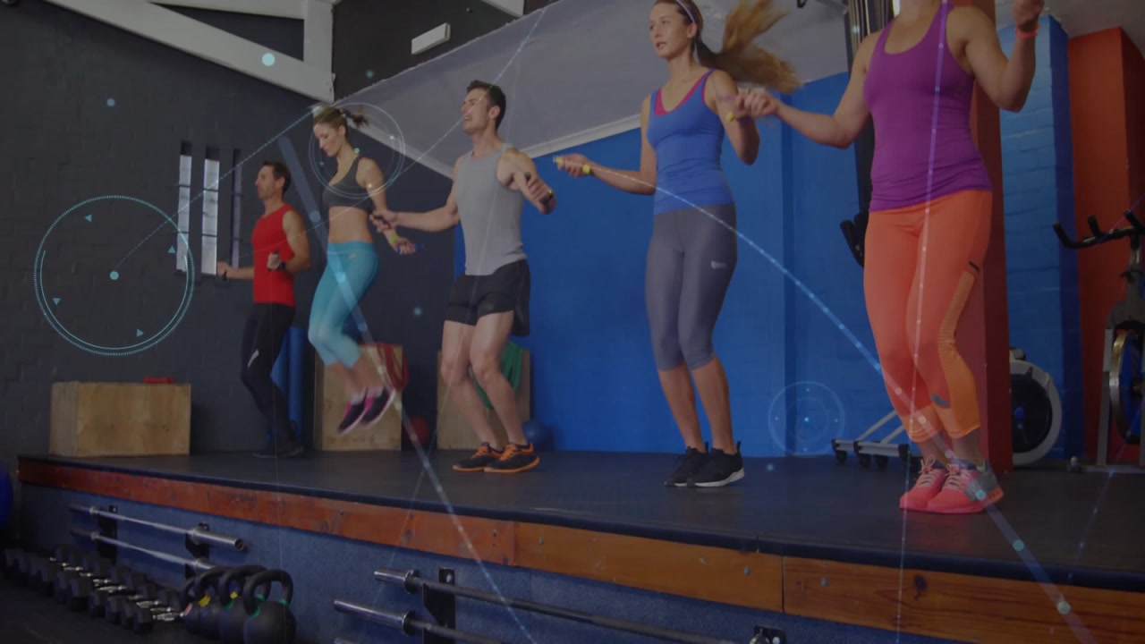 Fitness group rotating jump ropes backward and forward, initiating steady jumps with tracking lines