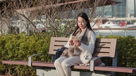 Pomeranian-dog-and-woman-outdoors