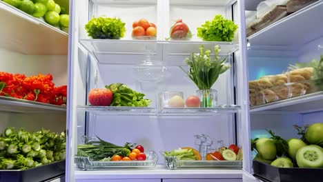 refrigerator is opening, revealing shelves full of fresh fruits, vegetables, and other healthy food