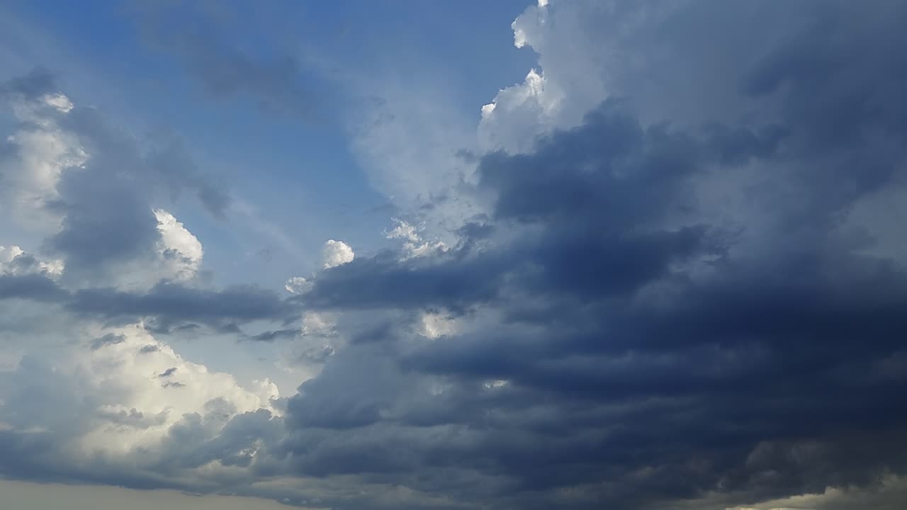 Storm clouds rolling and billowing, cumulunimbus, cumulus cloudscape 4k time-lapse footage