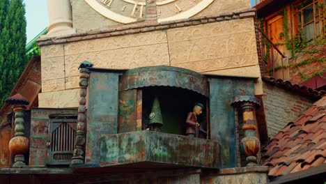 Detail-of-the-Rezo-Gabriadze-puppets-in-Leaning-Tower-of-Tbilisi-Clock,-old-people