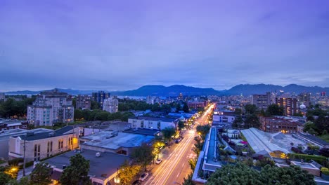 Time-lapse-of-sun-set-from-Penthouse-suite-in-Vancouver-British-Columbia,-Canada-over-looking-the-city-lights-to-the-Northshore-mountains