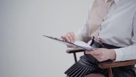 businesswoman holding clipboards. close up view of businesswoman with clipboards