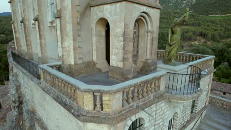 the chapel notre-dame de la consolation, built in 1894 atop a rocky spur overlooking a village in pierrelongue