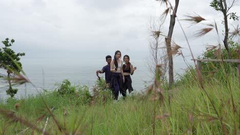 friends hiking by the coast