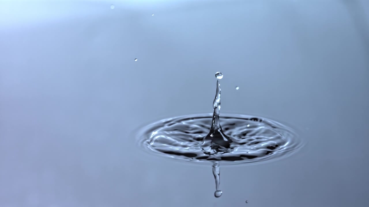 Slow Motion Water Drop Splashing and Creating Ripples
