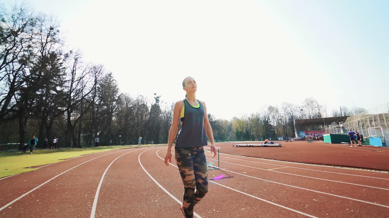 Sport reaction video Athletes at starting position preparing for run at the stadium. Healthy fitness lifestyle